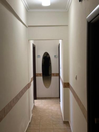 a hallway with a mirror on the wall at Apartments Villa Effie in Paralia Katerinis