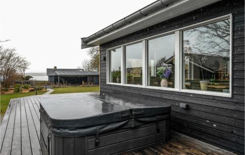 a pool sitting on the side of a house at Luxurious Home In Ølsted in Ølsted