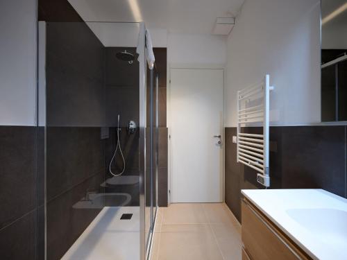 a bathroom with a sink and a shower in it at ApartmentsArena - Residenza Dei Doganieri - Verona in Verona