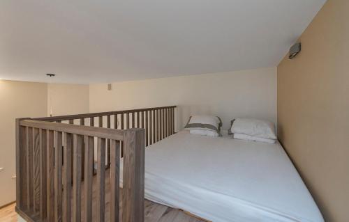 a bed in a room with a crib at Freedom Avenue Apartment by Polo apartments in Kaunas