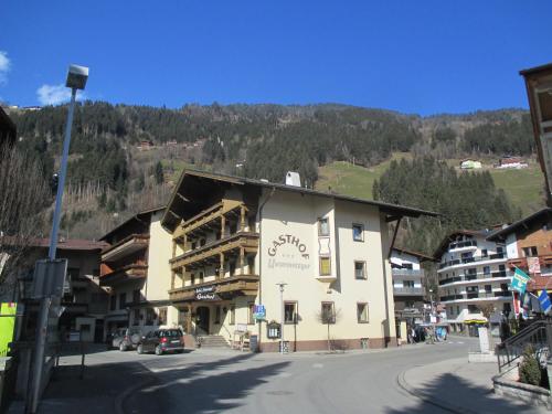 a large building on the side of a street at Hotel Untermetzger in Zell am Ziller