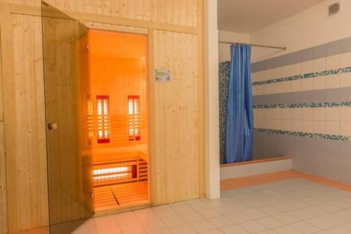a bathroom with a door open to a bathroom with a window at Golden Apartments Zakopane&S3 in Zakopane