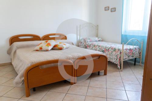 A bed or beds in a room at La Villetta del tranquillo sul mare, NUOVA STRUTTURA