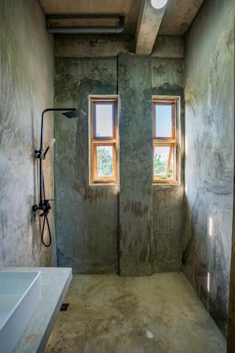 a bathroom with a bath tub and a window at Izustarri in Burgos
