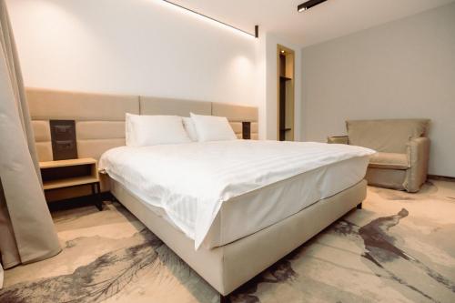 Кровать или кровати в номере Hotel Alexandrion Experience