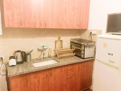 Two rooms apartment with a yard near the beach