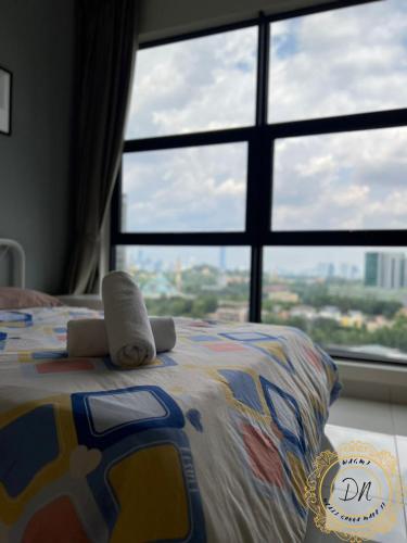 a bedroom with a bed with a large window at ARTE Mont Kiara Relax & Go_Jacuzzi in Kuala Lumpur