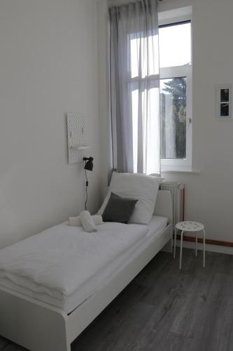 Ένα ή περισσότερα κρεβάτια σε δωμάτιο στο Schlafkonzept Hannover