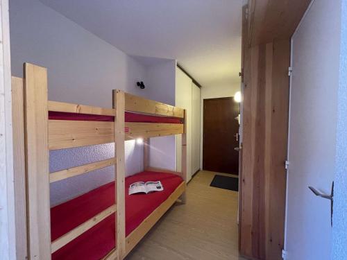 a bedroom with two bunk beds and a hallway at Appartement Saint-Chaffrey , 1 pièce, 4 personnes - FR-1-330E-49 in Serre Chevalier
