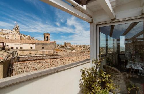 a view of a city from a window at Il Piccolo Attico in Caltagirone
