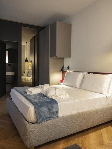 Una cama o camas en una habitación de Le Dimore del Toscano