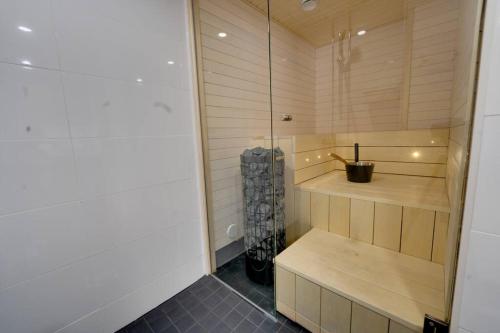 a room with a sauna with wooden walls at Upea kolmio+sauna parhaalla paikalla! in Tampere