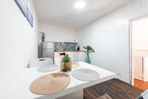 a kitchen with a table with two plates on it at House Old Town Dubrovnik in Dubrovnik