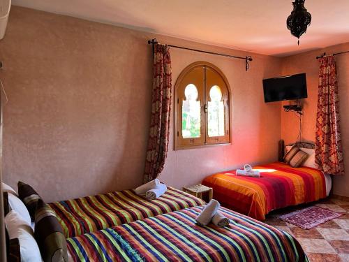 Una cama o camas en una habitación de Maison d´hôtes Amazir