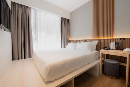 Katil atau katil-katil dalam bilik di Matata Hotel Kota Kinabalu