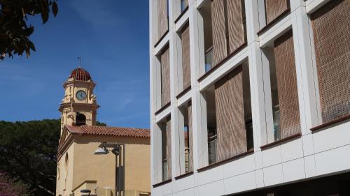 a building with a clock tower in the background at SOLIMAR 10 SALOU Solo FAMILIAS con Parking y piscina in Salou