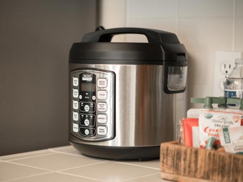 a black and silver toaster sitting on a kitchen counter at Home oasis with sauna, jacuzzi, pool & heated gazebo! in Clovis