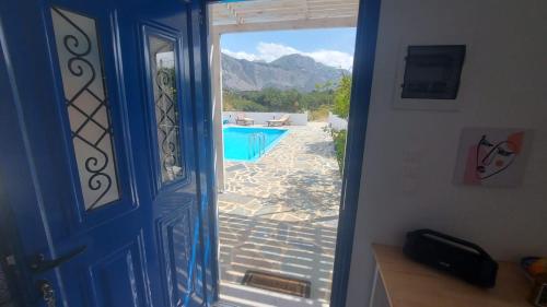 an open door with a view of a swimming pool at Villa Edna Crete in Agios Nikolaos