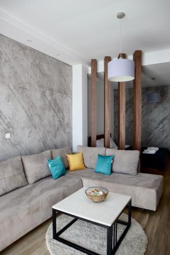 a living room with a couch and a table at PS Apartments in Ohrid