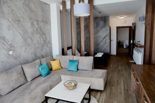 a living room with a couch and a table at PS Apartments in Ohrid