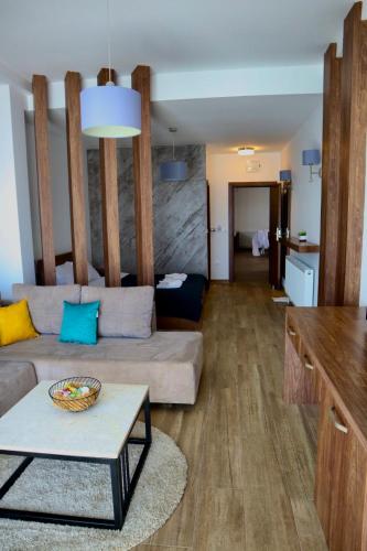 a living room with a couch and a table at PS Apartments in Ohrid
