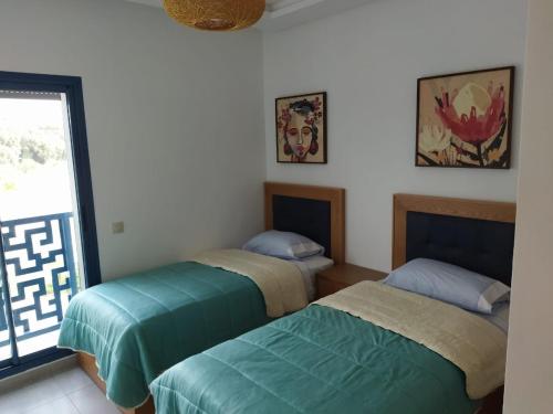 Postel nebo postele na pokoji v ubytování COSTA MAR MARTIL TETOUAN