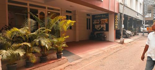 a man walking down a street in front of a store at CENTRAL GATE in Chennai