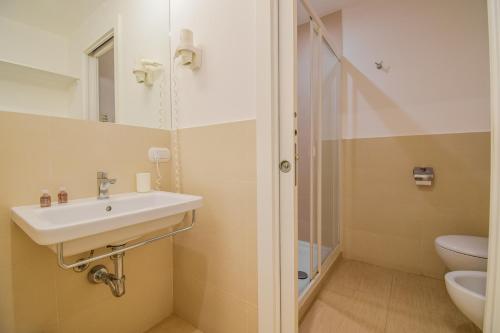 a bathroom with a sink and a shower at La Rosa dei Venti in Cefalù