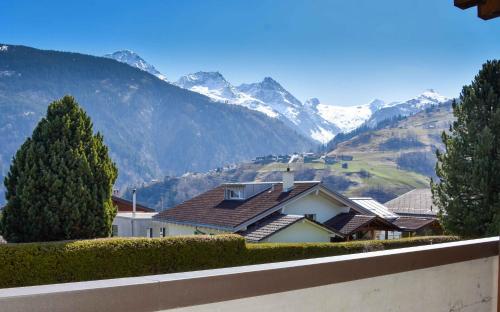 a house with a view of a mountain at Hotel Pazzola in Disentis