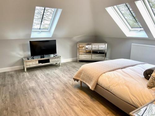 Μια τηλεόραση ή/και κέντρο ψυχαγωγίας στο Luxury 2 bed home