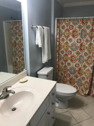 a bathroom with a sink and a toilet and a shower at Beautiful Condo in Ocean City