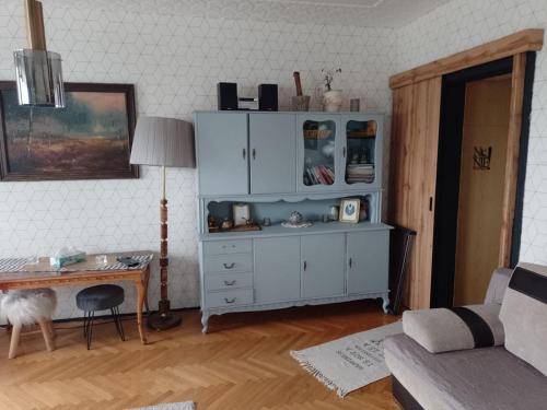 a living room with a desk and a white cabinet at Alterra Apartment,13 legionowa street, flat, mieszkanie 41 in Białystok