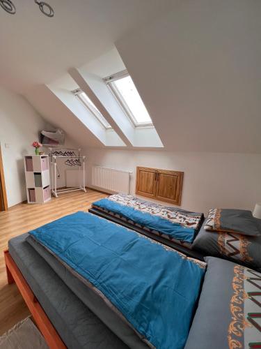 two beds in a large room with skylights at Ubytování v soukromí na Vysočině in Rokytnice nad Rokytnou