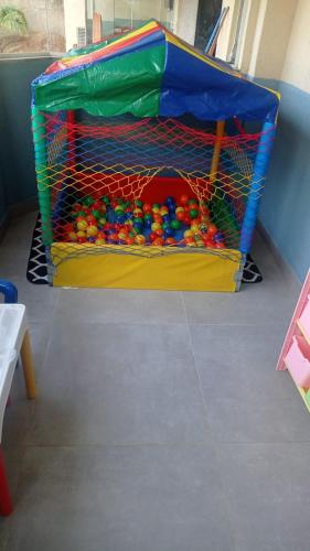a play area with a bunch of toys in it at Pousada Renovo da Serra in São Pedro da Serra
