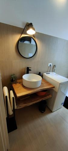 a bathroom with a sink and a mirror at Janus Casa nel Verde - Relax Pool & Spa in Giano Vetusto