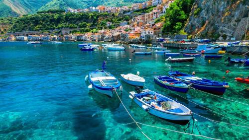 a group of boats in the water in a harbor at B&B La Veduta in Scilla