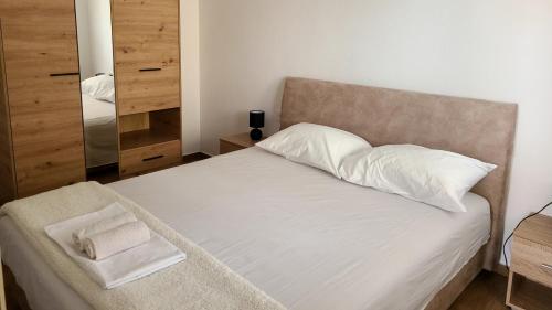 Ένα ή περισσότερα κρεβάτια σε δωμάτιο στο Ivovic apartments