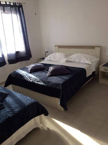 Ένα ή περισσότερα κρεβάτια σε δωμάτιο στο Apartments Biočić