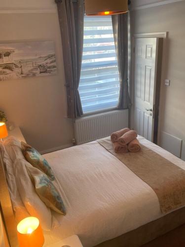 Ένα ή περισσότερα κρεβάτια σε δωμάτιο στο Rivendell Guest House