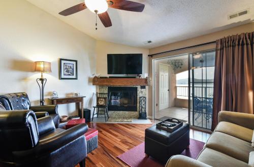 a living room with a couch and a fireplace at 3BR Lake View Condo - Stairs Required - Close to Marina - Pool -FREE TICKETS INCLUDED - 700EP in Hollister