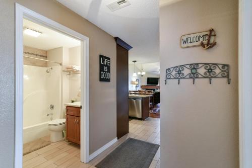 a bathroom with a toilet and a door with a sign at 3BR Lake View Condo - Stairs Required - Close to Marina - Pool -FREE TICKETS INCLUDED - 700EP in Hollister