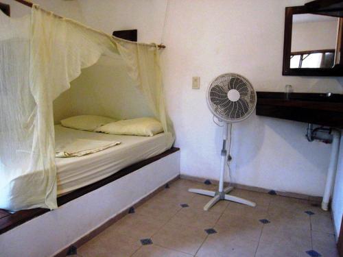 Tempat tidur dalam kamar di Los metates