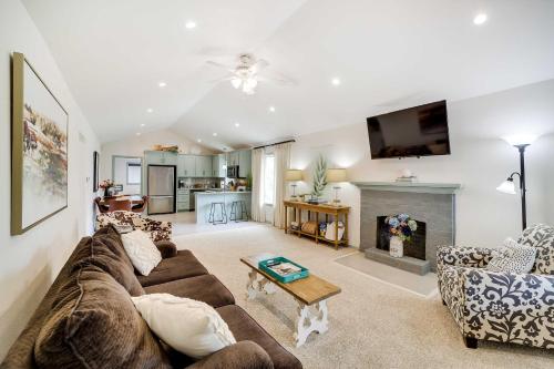a living room with a couch and a fireplace at Tulsa Vacation Home about 3 Mi to Downtown in Tulsa