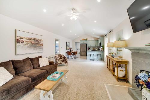 a living room with a couch and a fireplace at Tulsa Vacation Home about 3 Mi to Downtown in Tulsa
