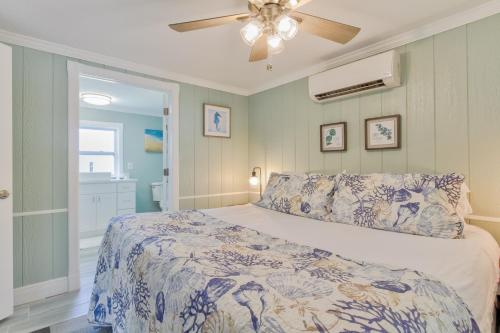 a bedroom with a bed and a ceiling fan at Pirates Pointe Resort in Ruskin