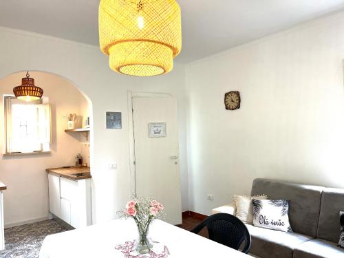 a living room with a couch and a table at Villetta con Oliveto CFG in Prizzi