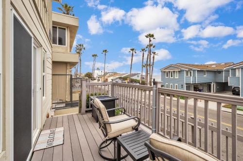 a balcony with two chairs and a table at Tower 9 #1 in Oceanside