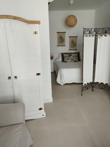 Ένα ή περισσότερα κρεβάτια σε δωμάτιο στο Casa Eva - Adults Only