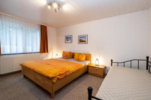 a bedroom with two beds and a window at Haus 1 in Ueckeritz