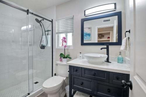 a bathroom with a toilet and a sink and a shower at Tower 9 D in Oceanside